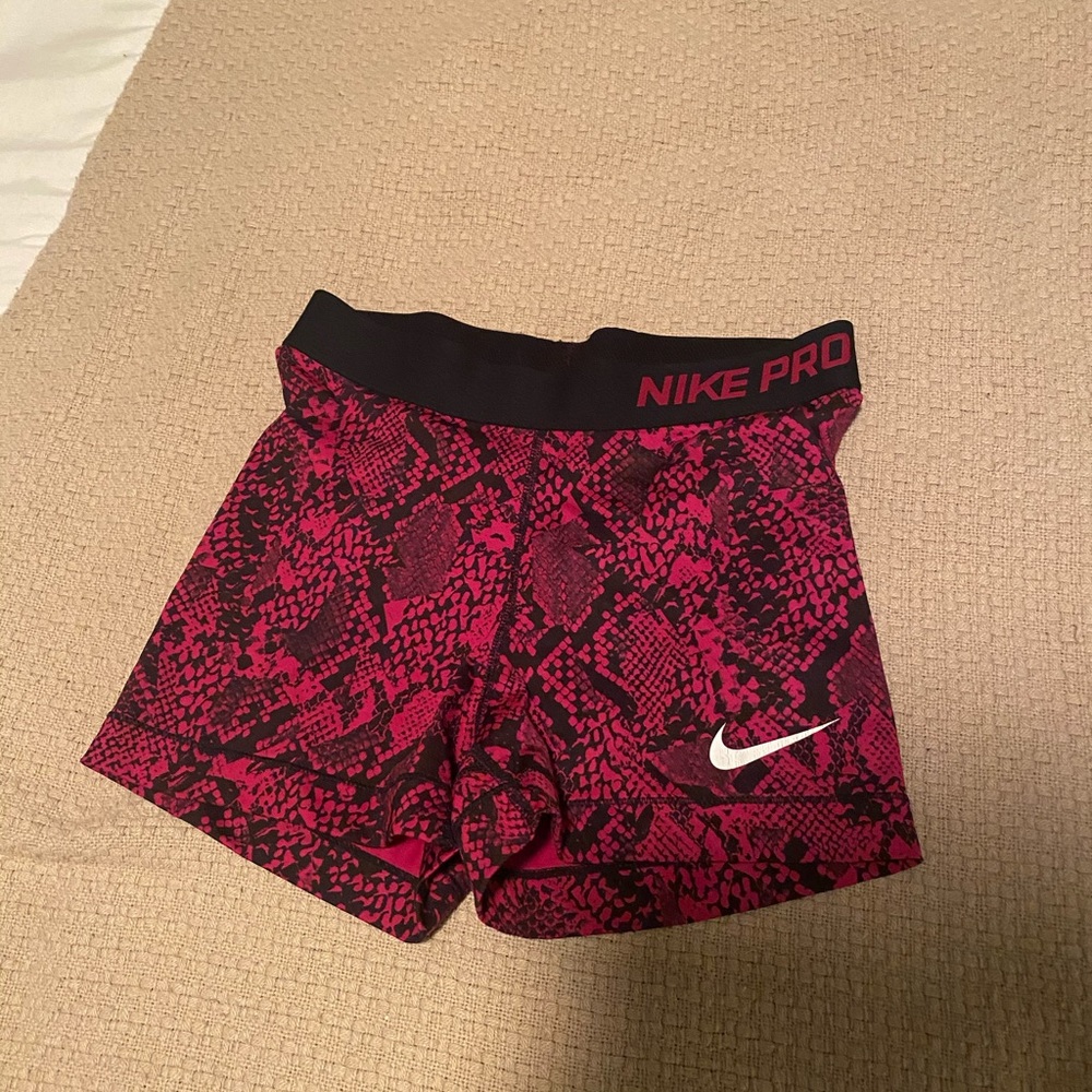 Dark pink snake Nike pros